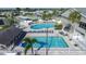 Aerial view of community pool with lounge chairs and well-maintained landscaping at 354 Blackburn Blvd, North Port, FL 34287