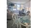 Relaxing sunroom with cozy seating, bright windows, and stylish accents for a comfortable living space at 354 Blackburn Blvd, North Port, FL 34287