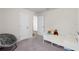 bedroom with plush carpet and doors that lead to other rooms in the home at 401 Calendar St, Port Charlotte, FL 33954