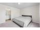 Comfortable bedroom featuring a well-made bed and an ensuite bathroom at 401 Calendar St, Port Charlotte, FL 33954