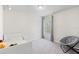 bedroom featuring plush carpet, a comfy chair and bright natural light at 401 Calendar St, Port Charlotte, FL 33954