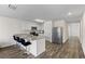 Bright kitchen with white cabinetry, stainless steel appliances, and granite countertops at 401 Calendar St, Port Charlotte, FL 33954