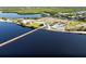 Wonderful aerial view of a community with many amenities, including a pool and pier at 4168 Harbor Blvd, Port Charlotte, FL 33952