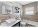 Bathroom features a white vessel sink, beige tile, and glass shower doors at 4168 Harbor Blvd, Port Charlotte, FL 33952