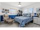 Cozy bedroom with a reading chair, bright windows and a white-and-blue motif at 4168 Harbor Blvd, Port Charlotte, FL 33952