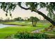 Picturesque golf course view with lush green fairways and pristine sand traps at 4168 Harbor Blvd, Port Charlotte, FL 33952