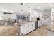 Beautifully updated kitchen with an island, granite counters, stainless steel appliances, and a breakfast bar at 4168 Harbor Blvd, Port Charlotte, FL 33952