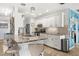 Well-appointed kitchen with a granite breakfast bar, stainless appliances, and contemporary white cabinetry at 4168 Harbor Blvd, Port Charlotte, FL 33952