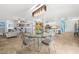 Bright living area with tile floors, decorative lighting, and seamless flow into the adjacent kitchen at 4168 Harbor Blvd, Port Charlotte, FL 33952