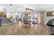 Inviting living space with travertine floors connecting dining, living, and kitchen areas for easy entertaining at 4168 Harbor Blvd, Port Charlotte, FL 33952