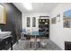 Bright office featuring black and white accents, modern desk and bookshelf, and tile flooring at 4168 Harbor Blvd, Port Charlotte, FL 33952