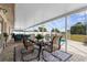 Outdoor patio with dining table, plush seating, and views of the sparkling pool at 4168 Harbor Blvd, Port Charlotte, FL 33952