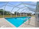 Refreshing swimming pool area with a paved deck, perfect for relaxation and enjoying the outdoor space at 4168 Harbor Blvd, Port Charlotte, FL 33952