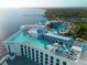 Amazing rooftop pool area with panoramic ocean views, sun loungers, and outdoor bar seating at 4168 Harbor Blvd, Port Charlotte, FL 33952