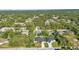 An aerial view shows a neighborhood dotted with lush greenery and well-maintained homes at 4331 Marcella Ter, North Port, FL 34286