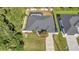 Aerial view of the property showcasing the fenced backyard, pool, landscaping, and proximity to neighboring homes at 4331 Marcella Ter, North Port, FL 34286