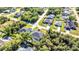 Aerial view of a neighborhood highlighting well-kept lawns and mature landscaping surrounding the homes at 4331 Marcella Ter, North Port, FL 34286