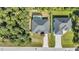 From above, observe the fenced-in backyard with a pool, mature trees, and well-kept landscaping at 4331 Marcella Ter, North Port, FL 34286