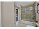 Bright bathroom with glass door shower, with view to lanai at 4331 Marcella Ter, North Port, FL 34286