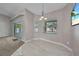 Dining area featuring large sliding glass doors, tile floors, and a modern chandelier at 4331 Marcella Ter, North Port, FL 34286