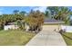 Charming home with a well-manicured lawn, mature tree and inviting curb appeal with a 2-car garage at 4331 Marcella Ter, North Port, FL 34286