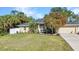 Inviting home with lush landscaping, mature trees, and a well-kept lawn offering excellent curb appeal at 4331 Marcella Ter, North Port, FL 34286