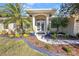 Elegant front entrance with decorative pillars, manicured landscaping, and a well-maintained walkway at 4331 Marcella Ter, North Port, FL 34286