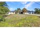 Inviting single-story home with a well-kept front yard, side fence, and a detached garage at 4331 Marcella Ter, North Port, FL 34286