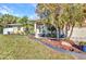 Charming single-story home with beautiful landscaping and a well-maintained lawn at 4331 Marcella Ter, North Port, FL 34286