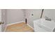 Functional laundry room featuring a utility sink and connections for a washer and dryer at 4331 Marcella Ter, North Port, FL 34286