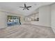 Living room with sliding glass doors leading to the pool, and open concept to the kitchen at 4331 Marcella Ter, North Port, FL 34286