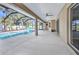 Covered patio and screened-in pool area with views of the yard at 4331 Marcella Ter, North Port, FL 34286