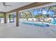 Relaxing screened-in pool with poolside seating and tropical landscaping at 4331 Marcella Ter, North Port, FL 34286