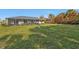 Extensive lawn featuring mature landscaping, bird bath and screened in patio area on house at 4420 Larkspur Ct, Port Charlotte, FL 33948