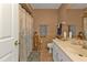 Bathroom featuring neutral tones, a shower with curtain, vanity with marble counter, and well-placed fixtures at 4420 Larkspur Ct, Port Charlotte, FL 33948