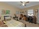 Bedroom features a ceiling fan and plenty of natural light, creating a comfortable space at 4420 Larkspur Ct, Port Charlotte, FL 33948