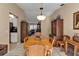 Warm dining area with wooden table and chairs, perfect for Gathering gatherings at 4420 Larkspur Ct, Port Charlotte, FL 33948