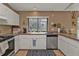 Well-lit kitchen featuring modern appliances and ample counter space for meal preparation at 4420 Larkspur Ct, Port Charlotte, FL 33948