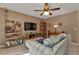 Inviting living room featuring neutral tones, a ceiling fan, and comfortable furnishings at 4420 Larkspur Ct, Port Charlotte, FL 33948