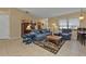 Comfortable living room featuring plush seating, stylish rug, and bright natural light at 4420 Larkspur Ct, Port Charlotte, FL 33948