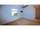Bedroom featuring carpet, a ceiling fan and a window with a view at 458 Azalea Nw Ave, Port Charlotte, FL 33952