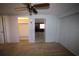 This light blue bedroom features carpet, a ceiling fan, and access to a closet at 458 Azalea Nw Ave, Port Charlotte, FL 33952