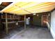 Spacious garage with overhead storage, workbench, and refrigerator at 458 Azalea Nw Ave, Port Charlotte, FL 33952