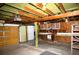 Open garage featuring storage shelves, a work bench, and two garage doors at 458 Azalea Nw Ave, Port Charlotte, FL 33952