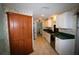 Classic kitchen features tile flooring, wooden cabinets, and green countertops at 458 Azalea Nw Ave, Port Charlotte, FL 33952