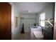 Bright laundry room includes utility sink, washing machine, and storage at 458 Azalea Nw Ave, Port Charlotte, FL 33952