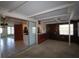 Open-concept living room featuring tile flooring, a kitchen and glass sliding doors at 458 Azalea Nw Ave, Port Charlotte, FL 33952