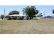 This property has a spacious yard, a charming white house, and is perfect for outdoor activities at 458 Azalea Nw Ave, Port Charlotte, FL 33952