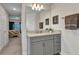 Well lit bathroom featuring a granite vanity and a view into an adjacent bedroom at 474 Rio De Janeiro Ave, Punta Gorda, FL 33983