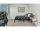 Bedroom featuring a bed, a desk, carpeted floors, and a Monopoly-themed poster at 474 Rio De Janeiro Ave, Punta Gorda, FL 33983